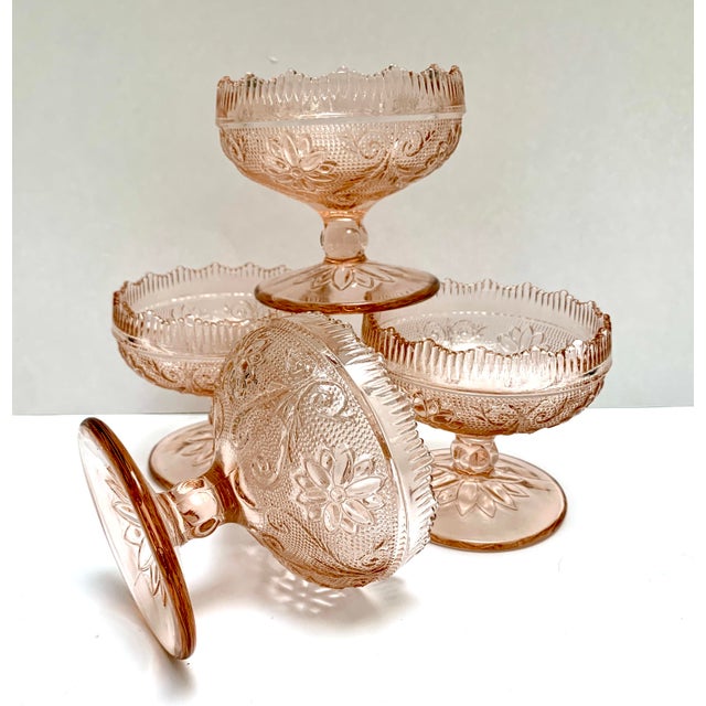Sweet set of four textured pink champagne colored coupes. Floral patterned with grooved and scalloped rims and floral stem...