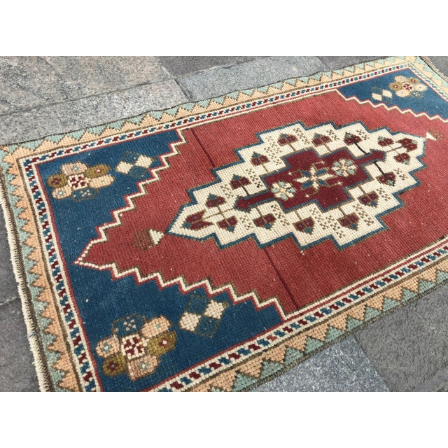 This is a vintage Turkish Oushak rug from the 1960s. The piece was hand-knotted.