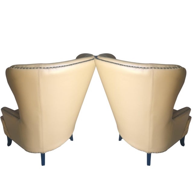 Hand-crafted with meticulous detail in the USA, these chairs feature: Premium Materials: Upholstered in Italian aniline...