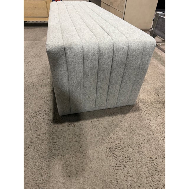 Bring sculptural softness and modern sophistication to a space with the Four Hands Augustine Bench, a beautifully tailored...