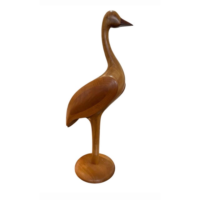 Elevate your interior styling with this striking vintage Mid-Century Modern hand-carved teak wood shorebird sculpture....