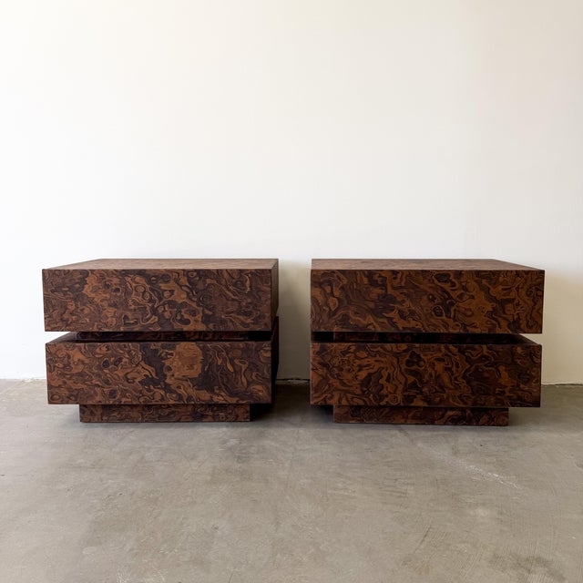 Vintage 1970s pair of burlwood nightstands featuring sleek architectural lines and a rich burlwood finish. Elegant...