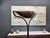 A beautiful and rare floor lamp by Florian Schulz. This elegant floor lamp has a solid slate base to which the brass lamp...