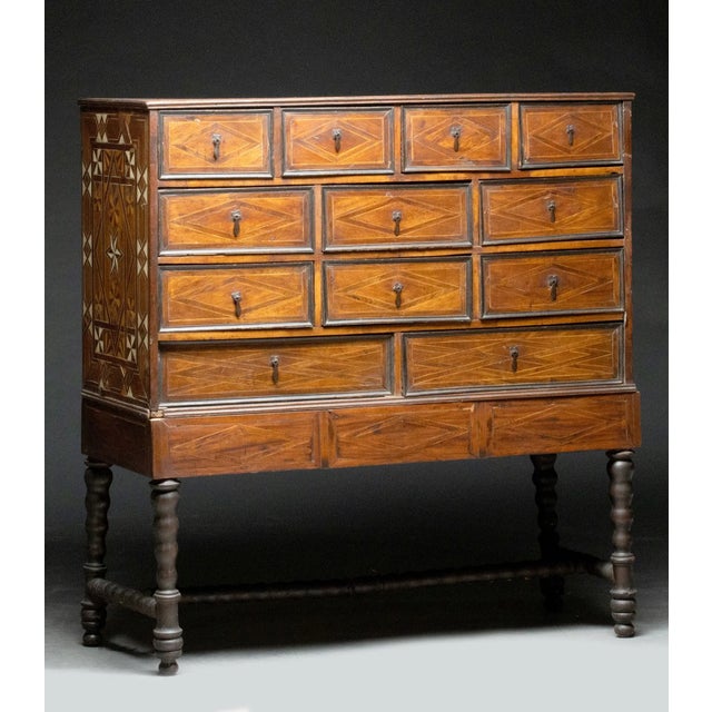 a cabinet on stand or collector's cabinet (such as a German or European 17th/18th-century monetiere or contador style case...