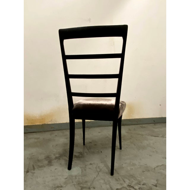 Set of 4 Mid Century chairs made in Italy in the 1950s. Black color and brown upholstery