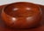 Turned wood bowl in Teak for Kay Bojeson. Appears to be completely original condition and patina. This piece is attributed...