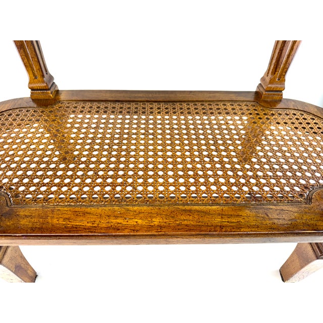 An elegant Drexel Heritage two-tier side table showcasing a richly figured burl wood top with a shaped gallery edge,...