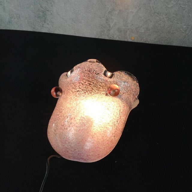 Italian wall light with original label. Painted metal plate and frosted and tinted glass diffuser (mounted with 2 glass...