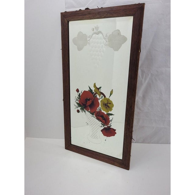 This is a Victorian-era reverse-painted and etched glass mirror — a rare combination of two 19th-century decorative glass...