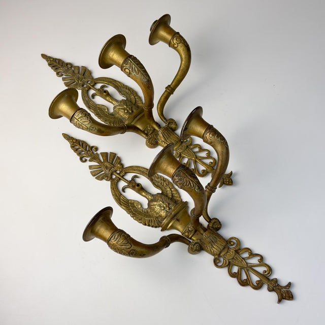 Antique pair of bronze wall candle sconces made in Italy early 20th century. They are made of bronze, heavy, with a...