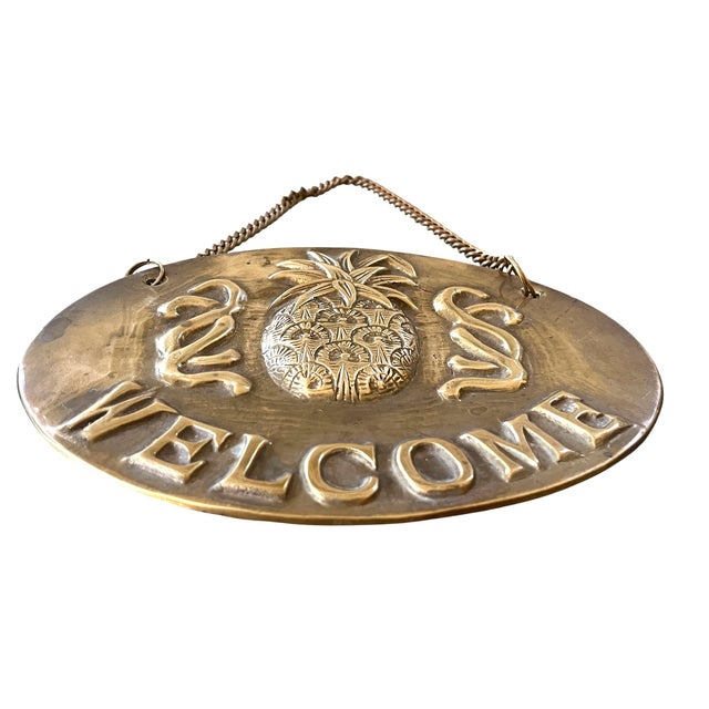 A timeless symbol of welcome, this vintage solid brass plaque centers on the iconic pineapple—long associated with...