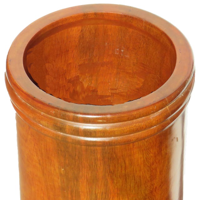 Elegant turned wood umbrella / walking stick stand. Simply detailed with reeded top, bottom, and midsection accents, this...