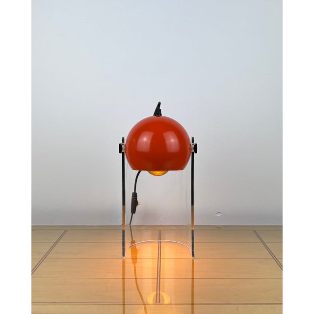 This captivating space age table lamp from 1970s germany showcases the era’s bold retro-futuristic design language. a...