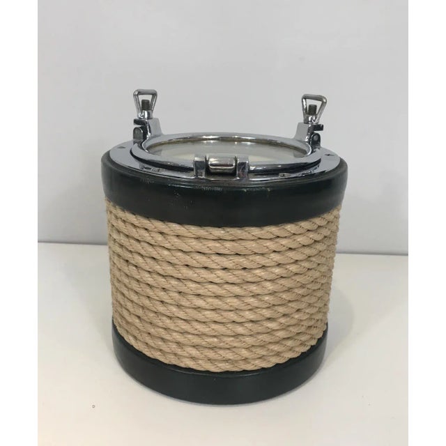 In the style of Jacques Adnet. Unusual chrome, leather and rope ice bucket, French, circa 1950.