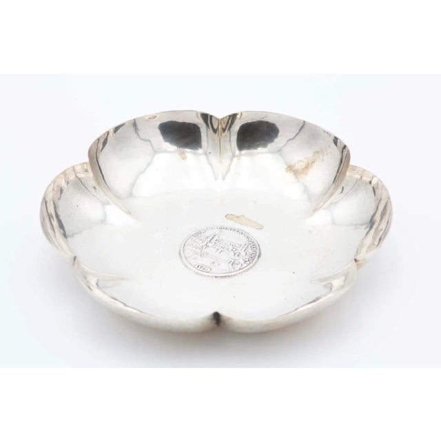 Flower-Shaped Silver Fruit Bowl with Swiss Coin, in Very Good conditions. Designed from 2000 This piece has an attribution...