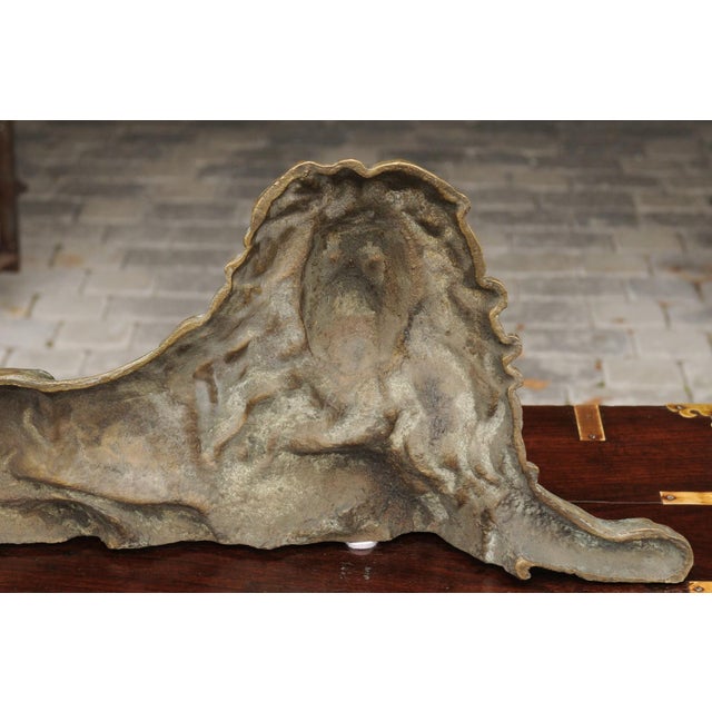 An English brass lion sculpture from the late 19th century, in a reclining position. Born in the later years of the 19th...