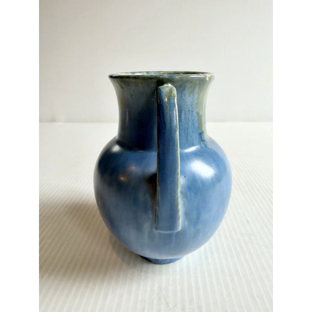 Mid Century pottery vase with a blue and green drip glaze style finish.