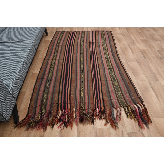 Vintage Turkish Hand-Knotted vintage rug is a semi-antique vintage area rug. The '70s Eastern region of Turkey's unique...