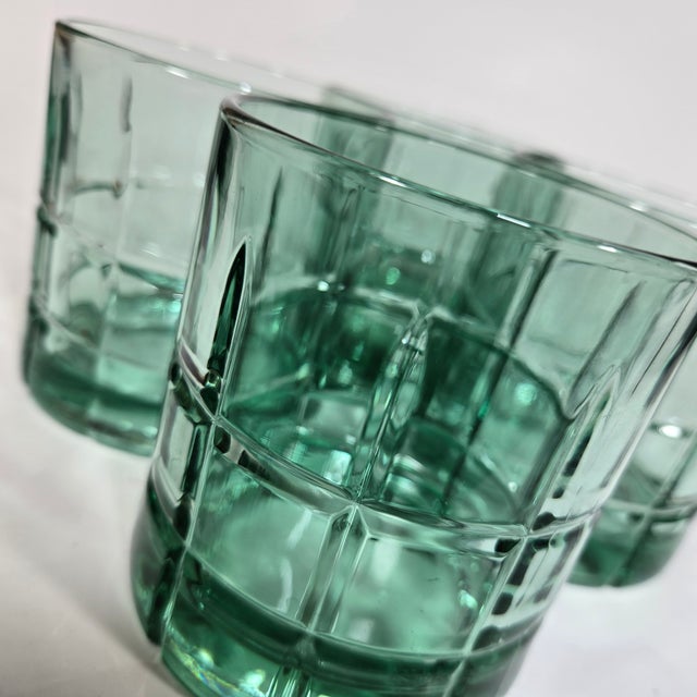 Gorgeous sea glass green shows off a stunning array of cuts, angles and faceted pressed glass.