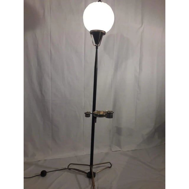 Mid-Century Floor Lamp Attributed to Stilnovo, in Very Good conditions. Designed 1950 to 1959 This piece is attributed to...