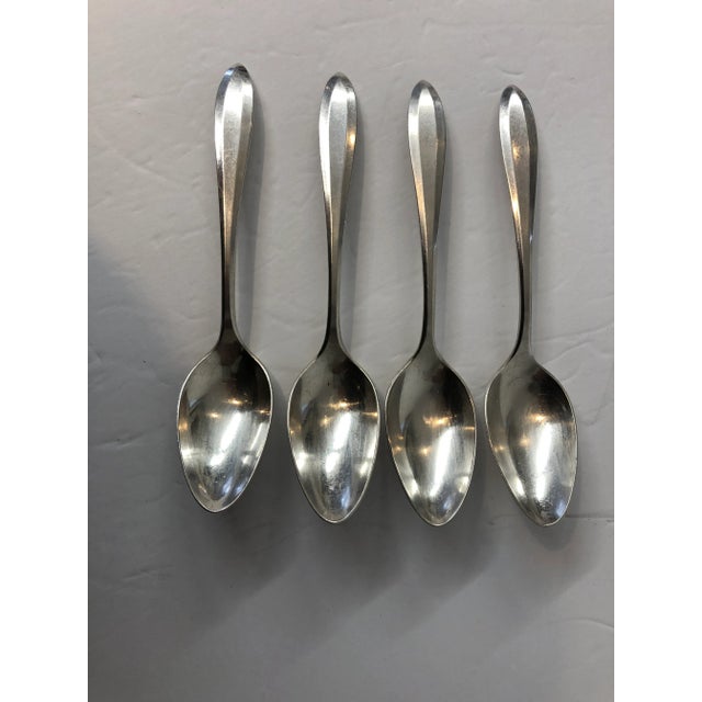 Antique set of 4 silver plated tea spoons, makers mark reads “ Community Plate” in very good condition, minor age wear. 6” L