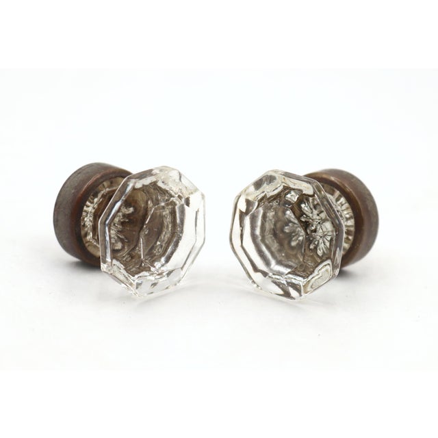 Vintage cabinet or drawer knobs made of clear glass with an octagon shape and brass shanks. Mounting screws are included....