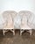 Vintage pair of rattan fan back arm chairs. Tall back chairs with pencil reed detail. Removable cushions with woven seats....
