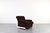 This armchair was manufactured in Germany in the 1970s. The seat and backrest are upholstered in the original, thick beige...