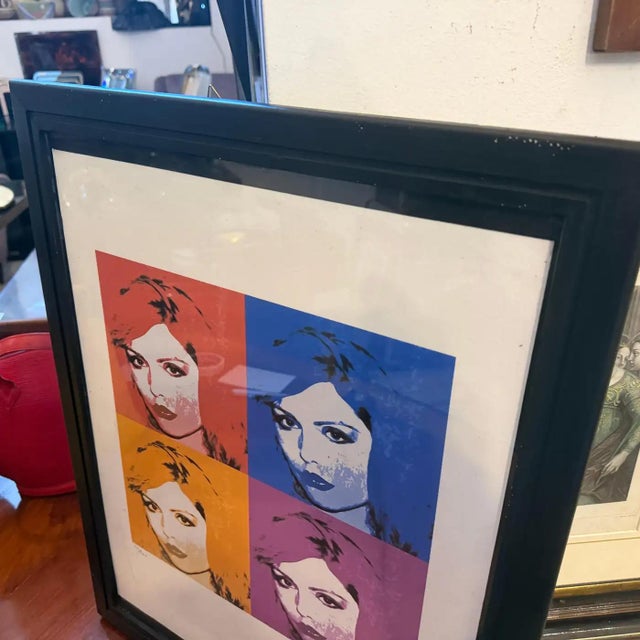 This striking, framed limited-edition lithograph features Andy Warhol’s iconic portrait of Blondie’s legendary frontwoman,...