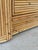 Stunning vintage pencil reed rattan chest featuring a sculptural arched design across the drawer fronts with beautifully...