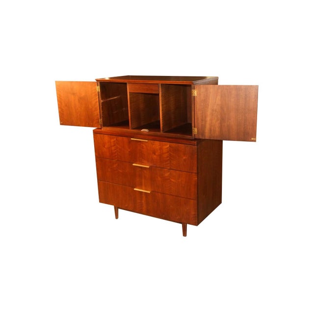 Absolutely stunning Mid-Century Modern Highboy dresser designed by John Stuart for Johnson Furniture Co. in the United...