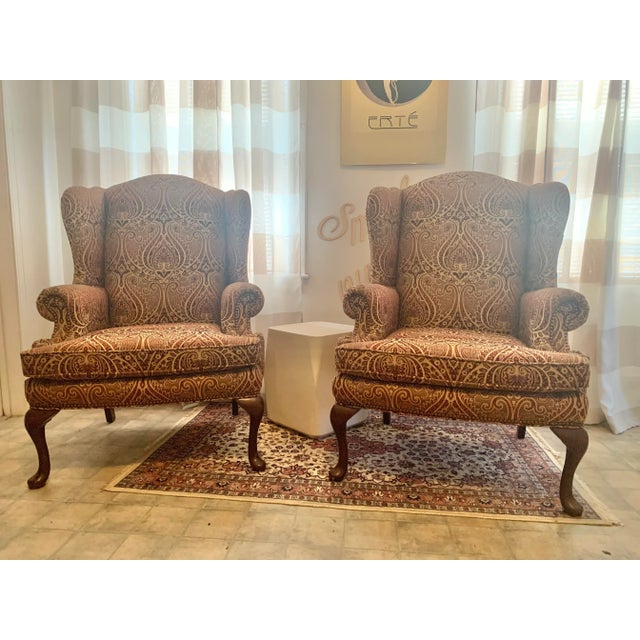 beautifully appointed pair of vintage wingback chairs in stunning paisley tweed .earth tones of cream , tans and cinnamon...