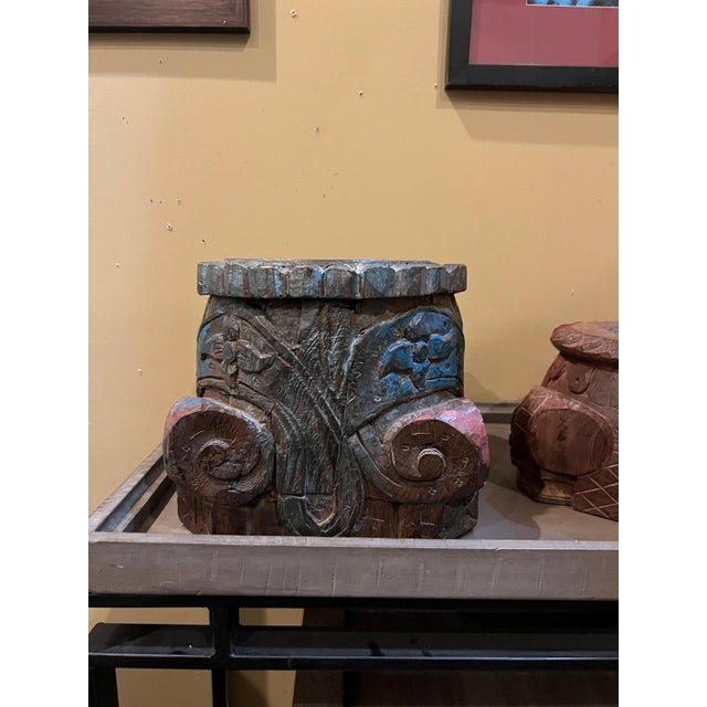 Distinctive hand-carved wooden candle base featuring bold architectural carving and beautifully aged wood. The piece is...