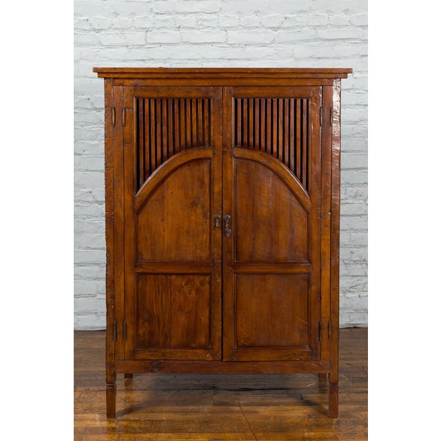 Javanese Antique Teak Armoire with Slatted Motifs, Tapered Feet and