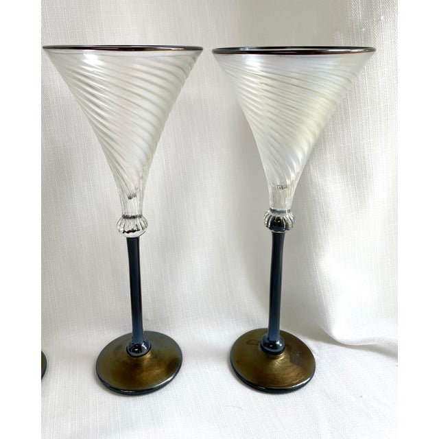 Stunning set of 6 art glass wine goblets or martini glasses by renowned glass blower Rick Strini. The bowl of the glass is...
