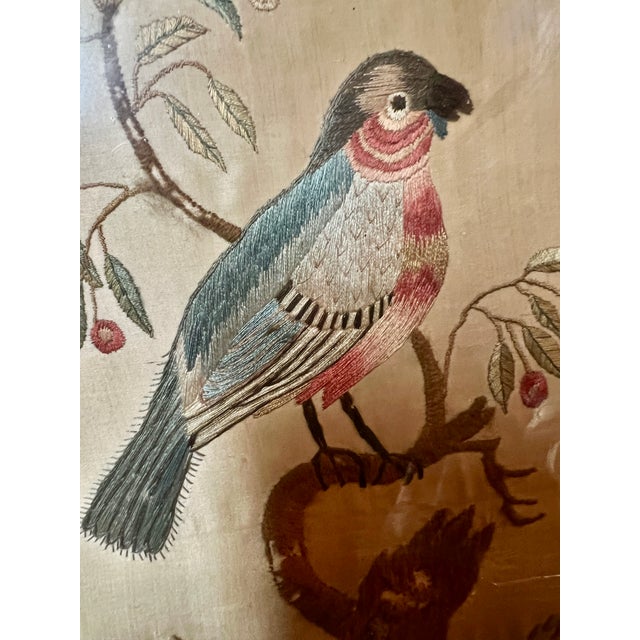 A magnificant late Georgian-era (circa 1790-1830) needlework picture depicting a beautifully detailed exotic bird or...