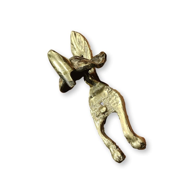 Late 19th century English fox form door knocker cast with expressive naturalistic detail and elongated front legs forming...
