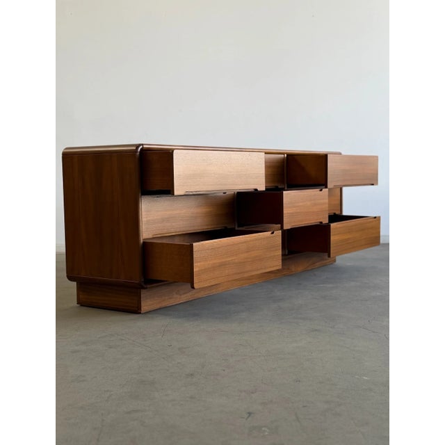 H29 D18.75 W77.13 Beautiful vintage teak dresser freshly restored and professionally refinished. This piece features six...