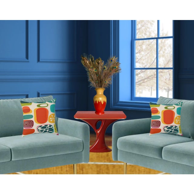 This handmade 12-inch drip glaze pottery vase is a striking fusion of artistry and tradition. Its silhouette is...