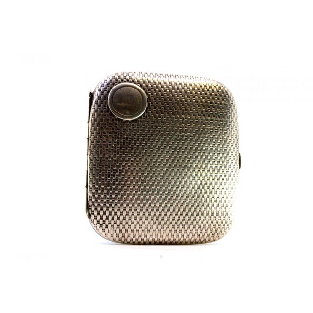 Silver Cigarette Case with Recessed Reliefs, Monogram Card and Gold Interior, in Very Good conditions. Designed 1890 to...