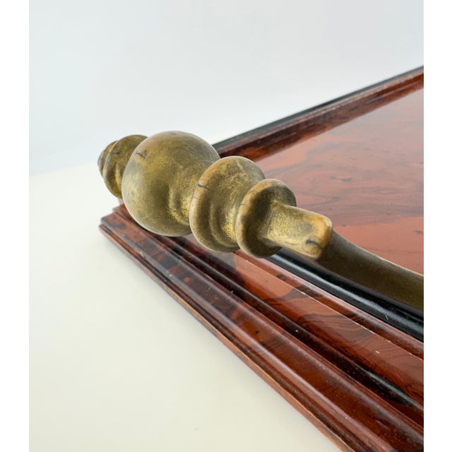 A striking vintage Italian serving tray handcrafted in wood with a richly lacquered faux tortoiseshell finish. The...