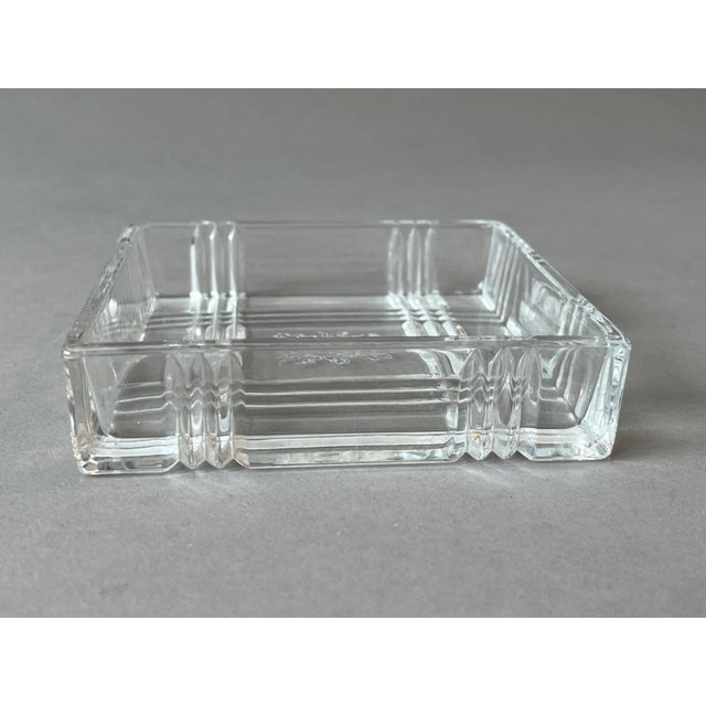 This Clear Glass Crystal 4.25" Plaid Faceted Square Ashtray w/ Etched Sun Face is in excellent condition with no flaws. It...