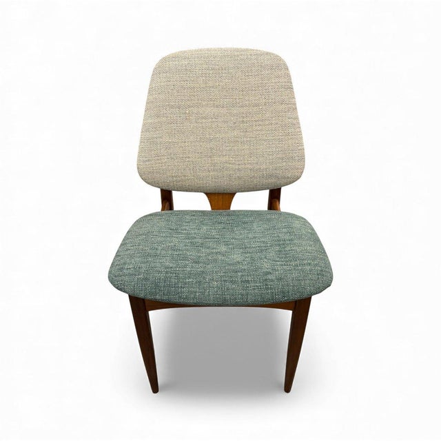 Set of four Mid-Century chairs made of teak. A British design from the 1960s by Elliots of Newbury, featuring high-quality...