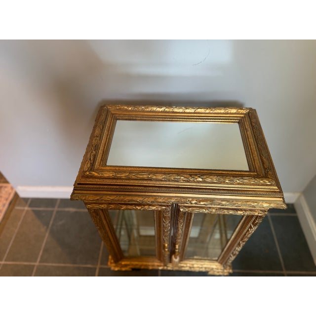 Elevate any room with this pair of stunning gold gilt display cabinets, richly detailed and beautifully crafted. Each...