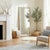 The Butler Specialty Company Flora Full Length Floor Mirror radiates natural charm with its handwoven rattan frame and...