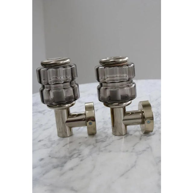 Discover 2 wall lights made in Demark 60s 70s Hans Agne Jakobsen era. Up to 250V (Europe/UK Standard).The wiring of this...