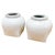 Striking pair of heavy, sculptural glazed clay urns. A great balance between rustic flair and modern minimalism, these...