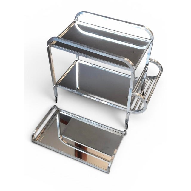 A striking original French Art Deco drinks trolley, dating from the 1930s, showcasing the elegant geometric styling and...