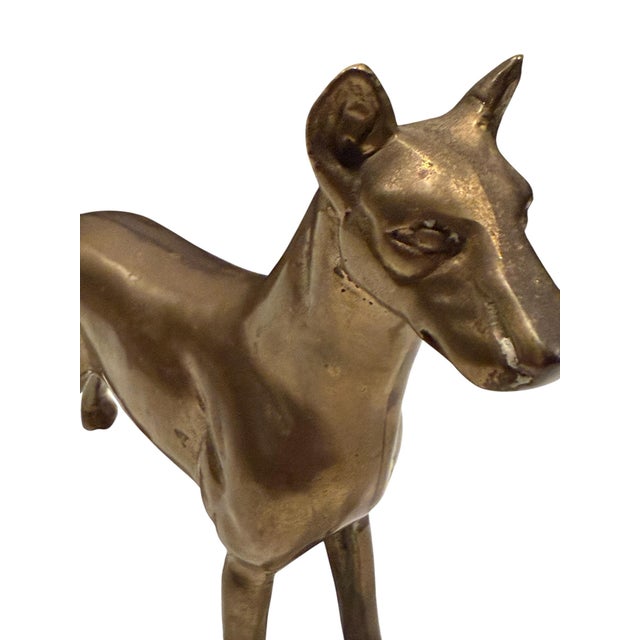 The Doberman Pinscher, known for its distinctive appearance, has been a frequent subject in decorative arts due to its...
