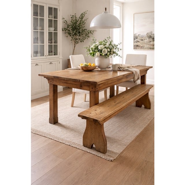 A charming antique English pine bench, rich in character and showcasing a beautifully timeworn patina. Crafted from solid...